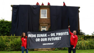 Environmental activists arrested after covering UK PM's home in black