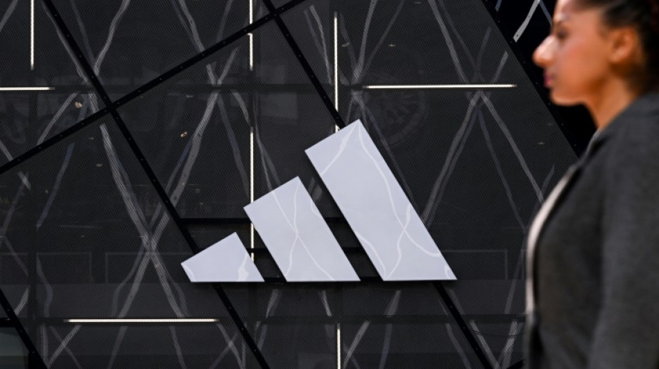 Adidas shares slump on downbeat profit outlook